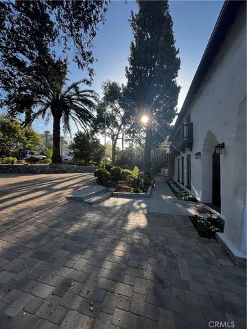 a view of a house with a flower garden