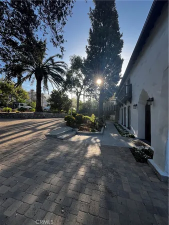 a view of a house with a flower garden