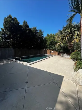 a view of swimming pool from a yard