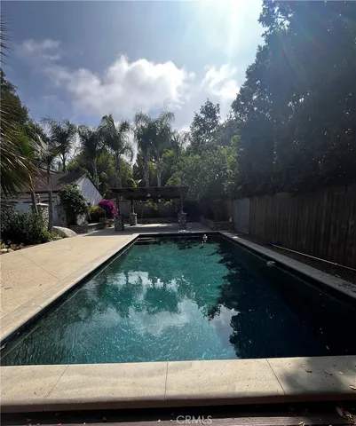 a view of swimming pool with a yard