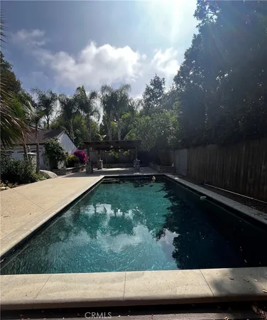 a view of swimming pool with a yard