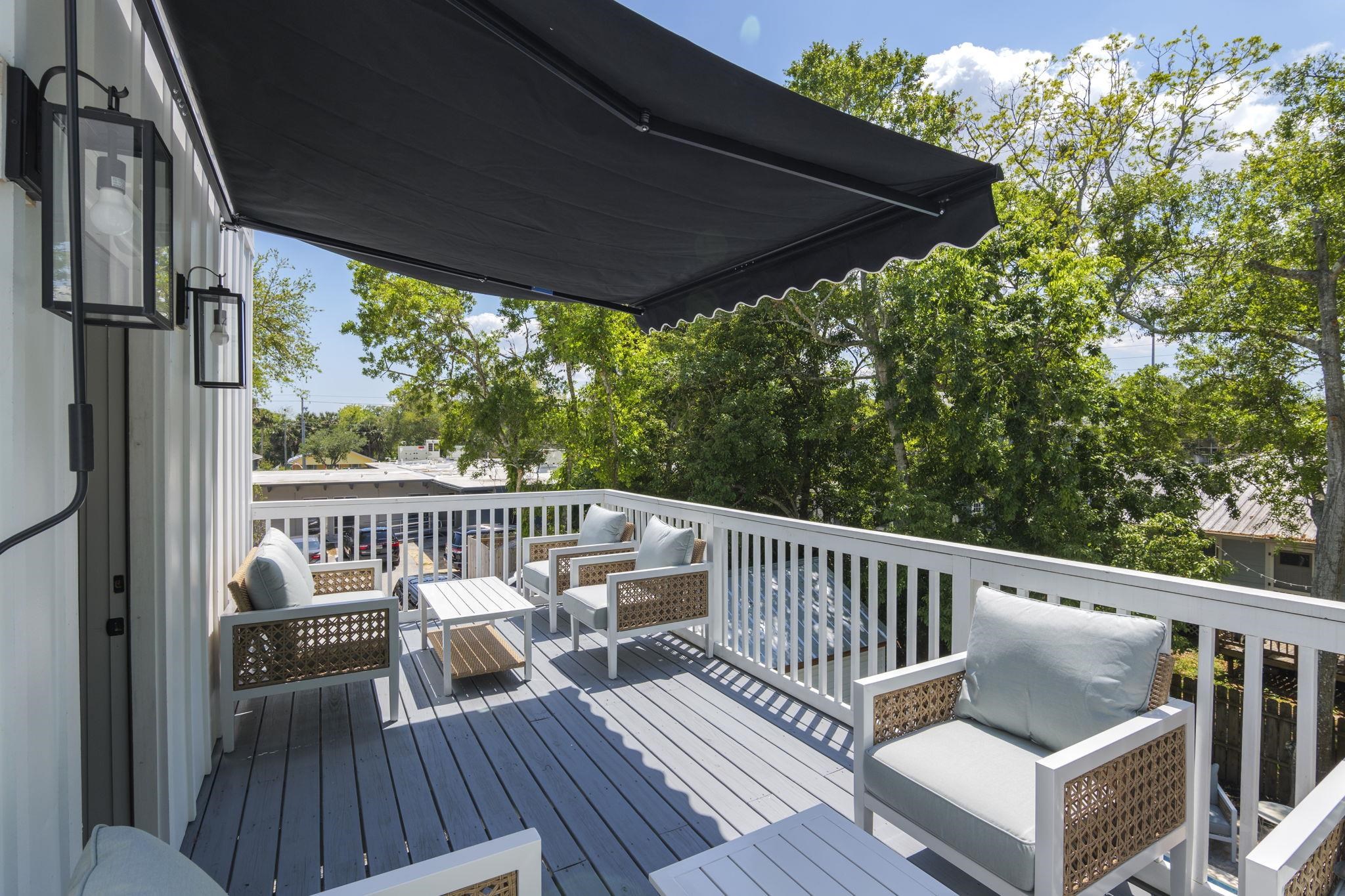 160 Blanco Street St. Augustine, FL 32084 - Photo 21 of 43 a view of a deck with wooden floor and outdoor seating