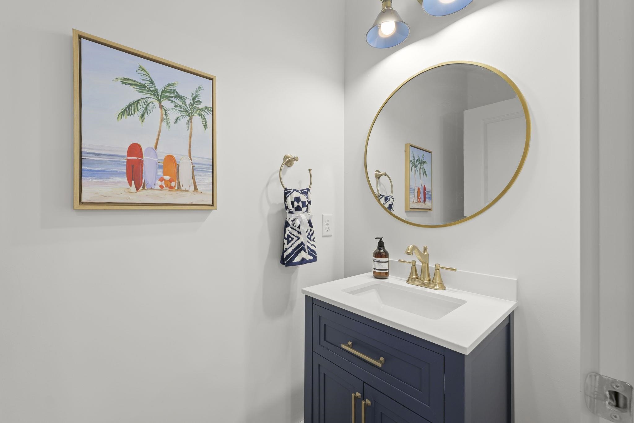 160 Blanco Street St. Augustine, FL 32084 - Photo 24 of 43 a bathroom with a sink and a mirror