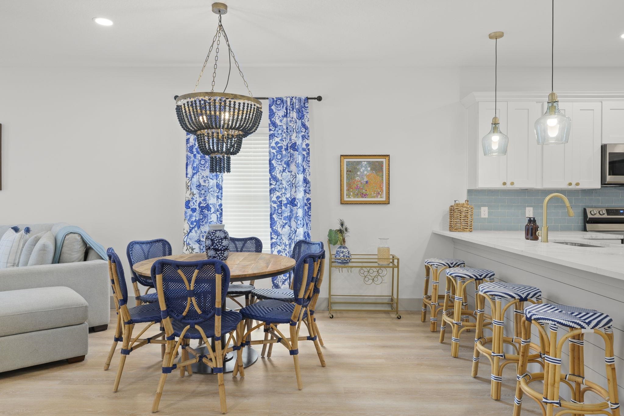 160 Blanco Street St. Augustine, FL 32084 - Photo 25 of 43 a view of dining room and livingroom with furniture wooden floor a chandelier
