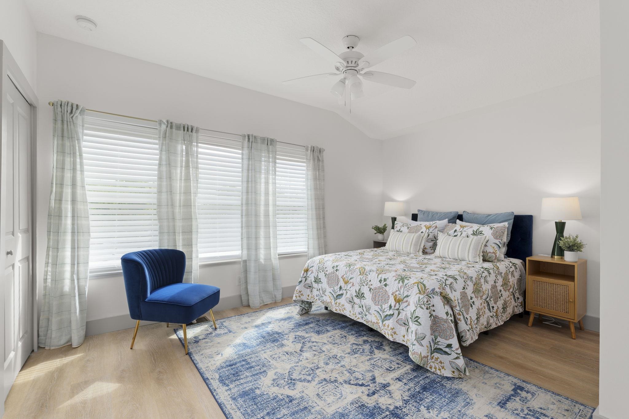 160 Blanco Street St. Augustine, FL 32084 - Photo 30 of 43 a bedroom with a bed and a chair