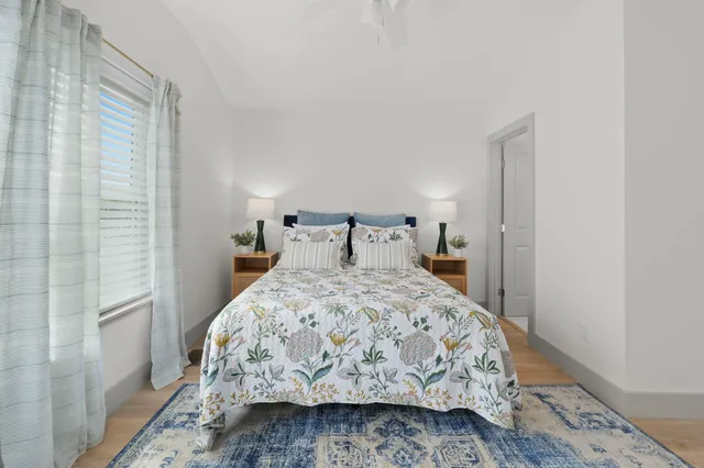 a bedroom with a bed and a chair