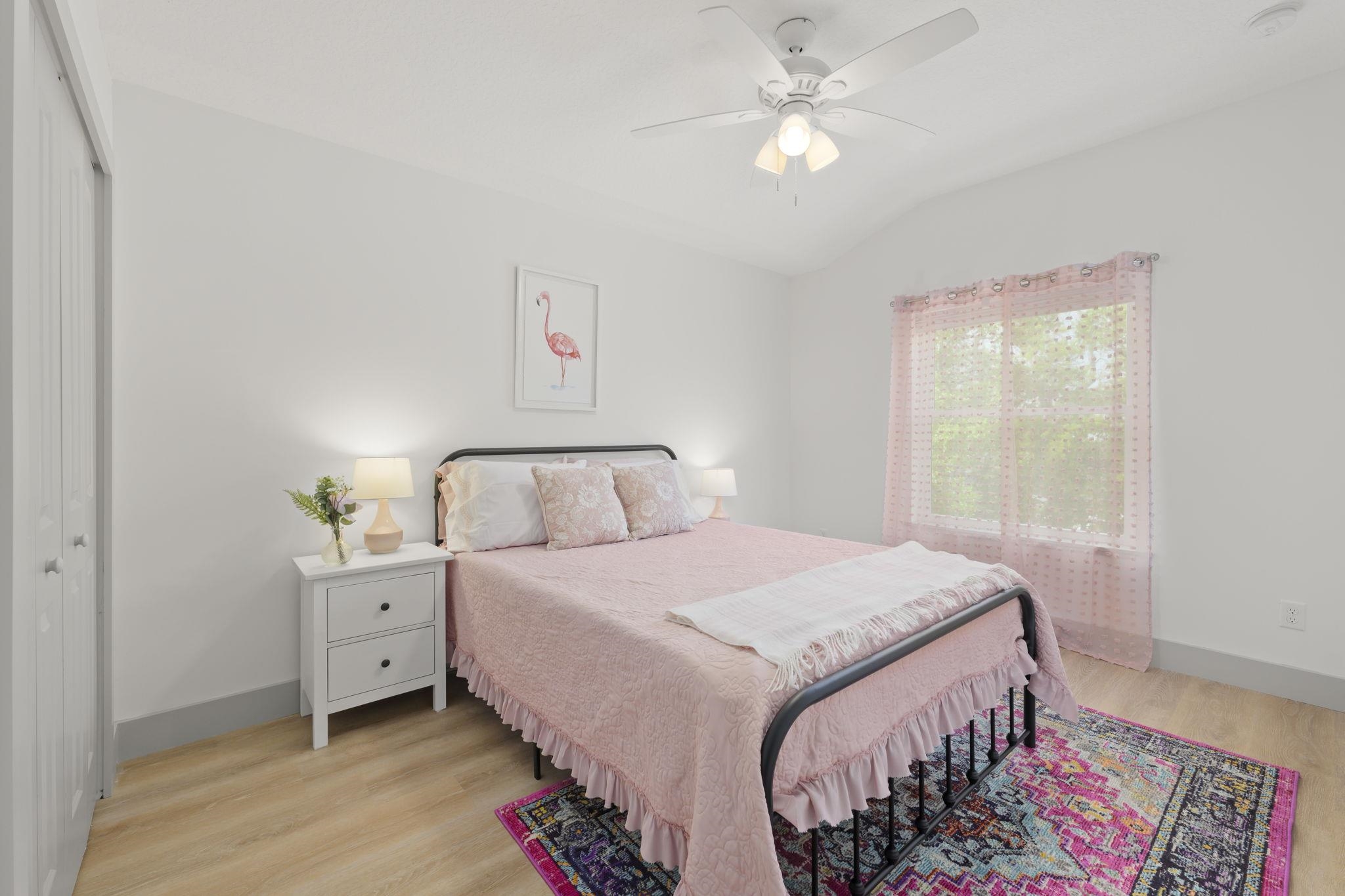 160 Blanco Street St. Augustine, FL 32084 - Photo 37 of 43 a bedroom with a bed and a chandelier
