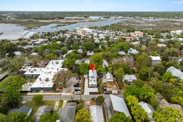 an aerial view of a house with a yard
