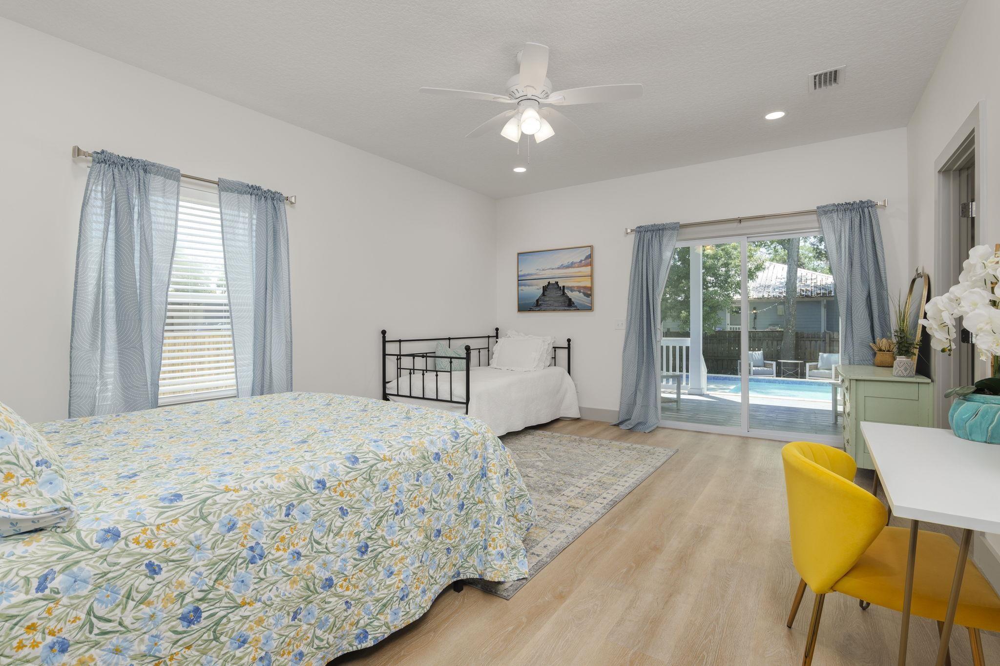 160 Blanco Street St. Augustine, FL 32084 - Photo 6 of 43 a spacious bedroom with a bed and a large window with outer view