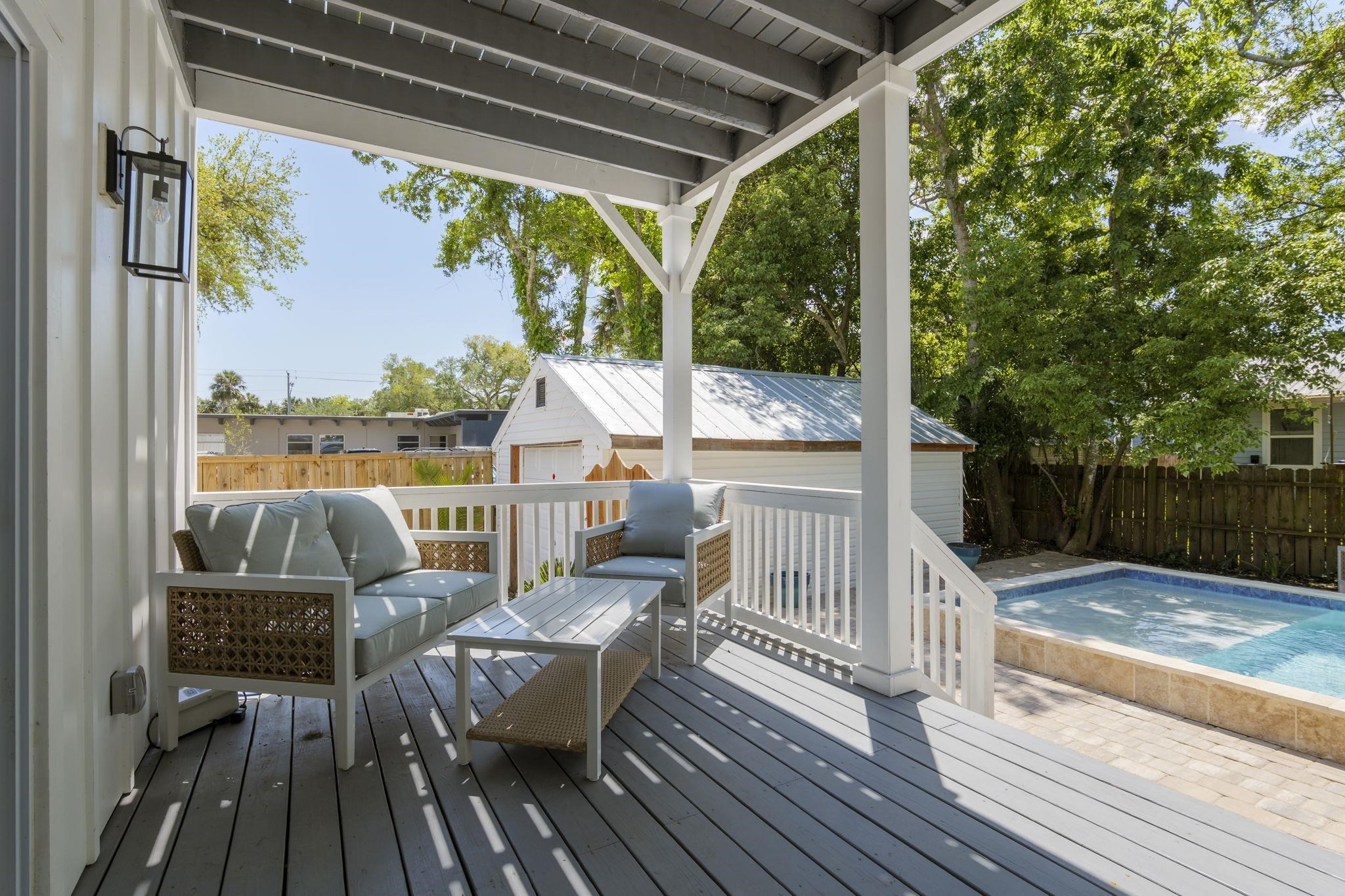 160 Blanco Street St. Augustine, FL 32084 - Photo 9 of 43 a view of a chair and tables in the balcony
