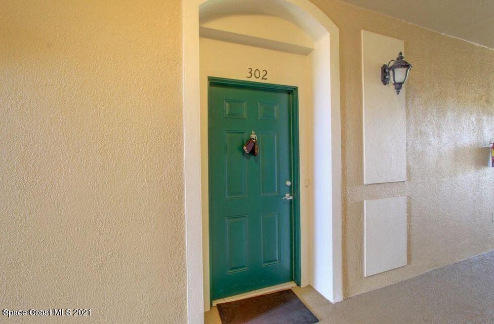 3848 Lexmark Lane, Unit 302 Rockledge, FL 32955 - Photo 2 of 18 a view of a bathroom from a hallway