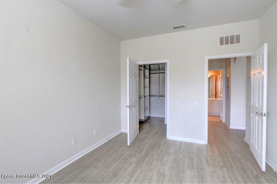 3848 Lexmark Lane, Unit 302 Rockledge, FL 32955 - Photo 14 of 18 a view of a hallway with wooden floor
