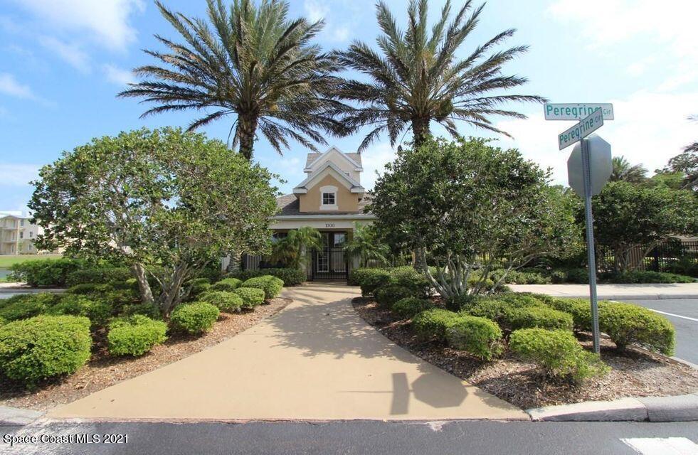 3848 Lexmark Lane, Unit 302 Rockledge, FL 32955 - Photo 17 of 18 a front view of a house with a garden