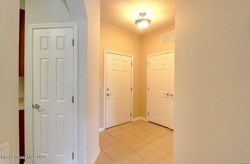 3848 Lexmark Lane, Unit 302 Rockledge, FL 32955 - Photo 9 of 18 a view of a hallway with wooden floor
