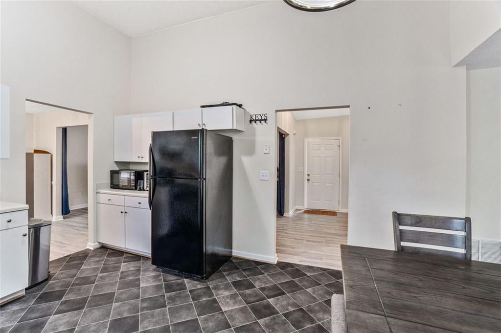 675 Michael Circle Monroe, GA 30655 - Photo 14 of 34 a kitchen with a refrigerator and a sink