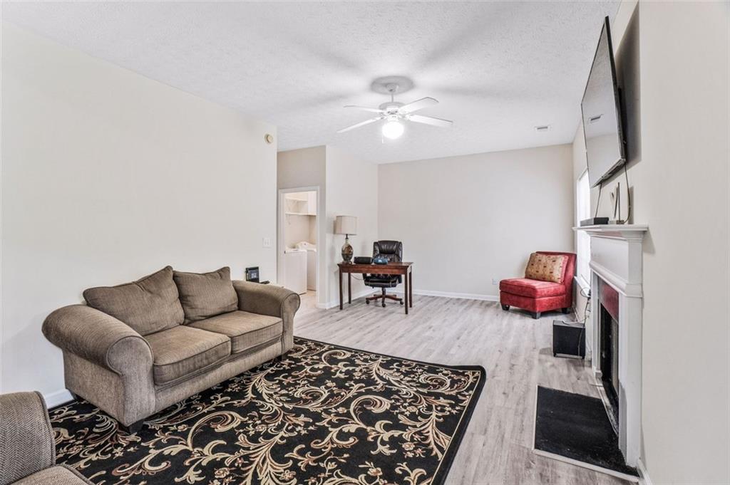 675 Michael Circle Monroe, GA 30655 - Photo 17 of 34 a living room with furniture and a rug