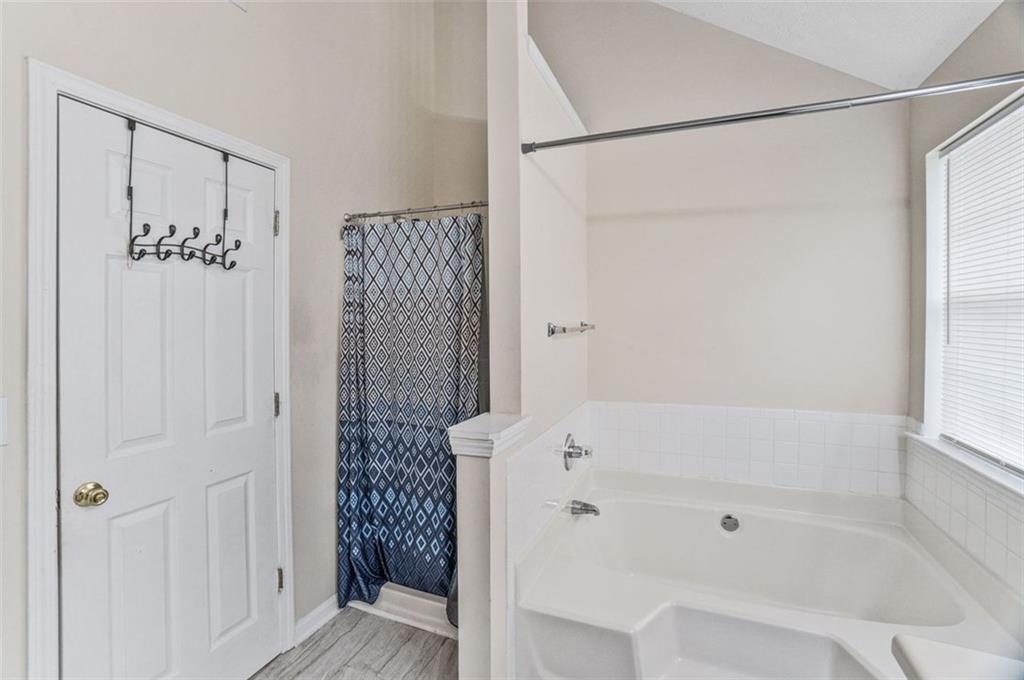 675 Michael Circle Monroe, GA 30655 - Photo 32 of 34 a bathroom with a bathtub and shower