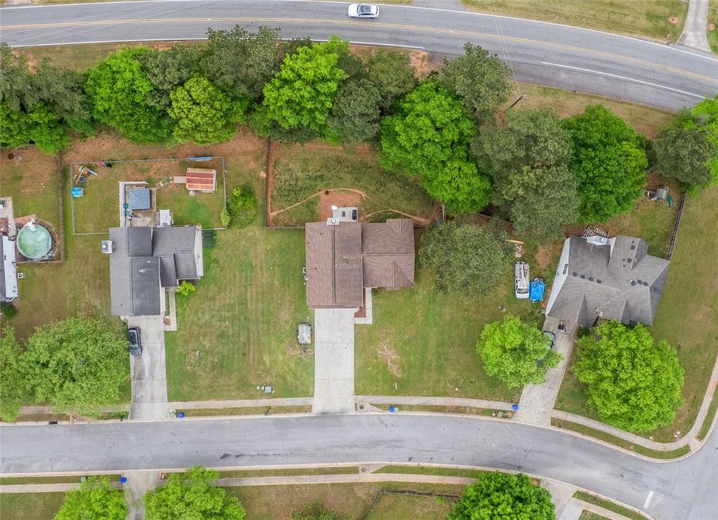 675 Michael Circle Monroe, GA 30655 - Photo 4 of 34 an aerial view of a house with a yard and garden