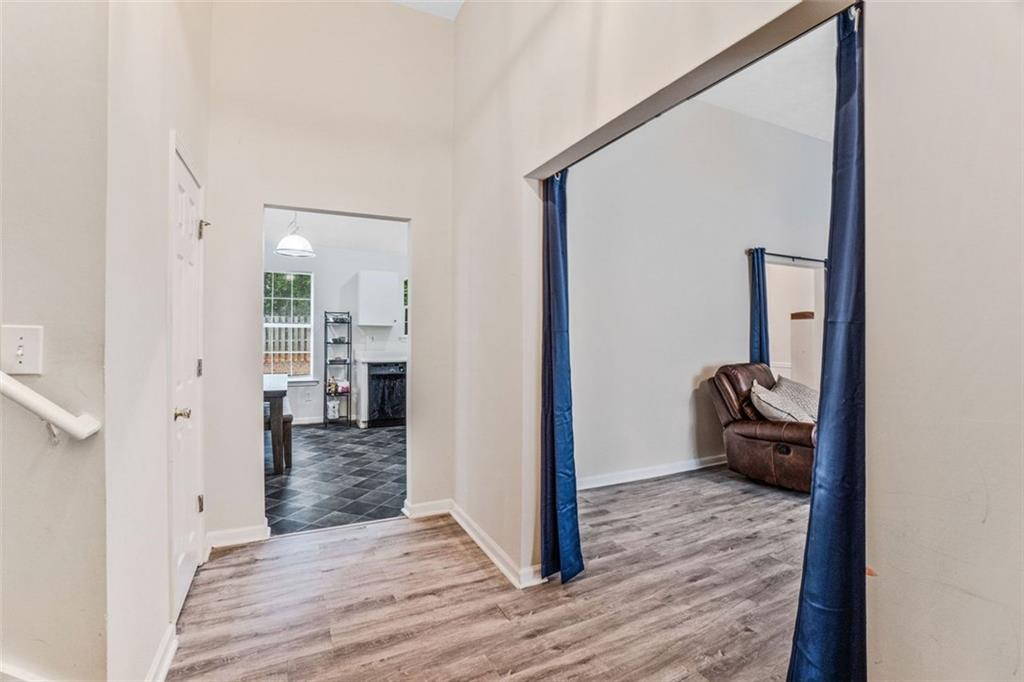 675 Michael Circle Monroe, GA 30655 - Photo 5 of 34 a view of a hallway with wooden floor and a bedroom