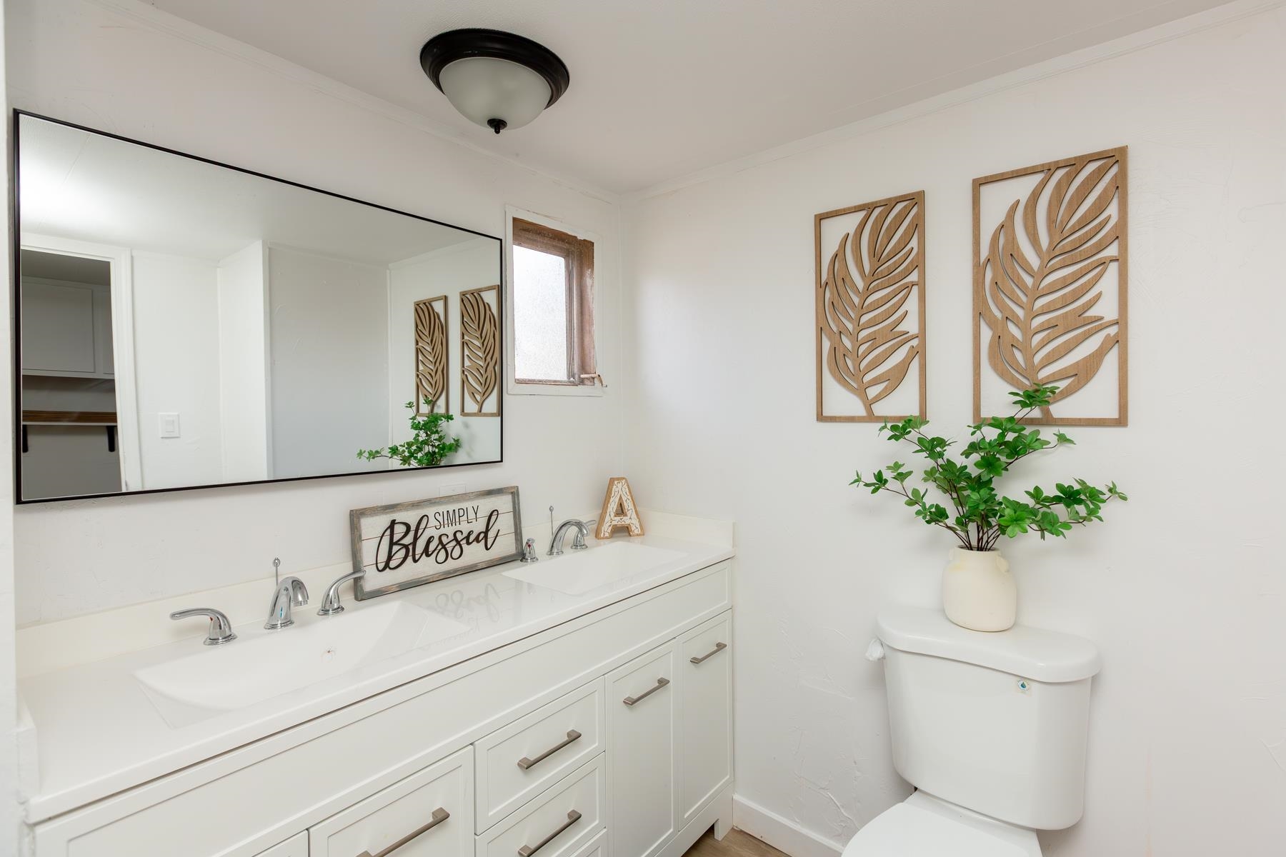 424 32 Road, Unit 112 Clifton, CO 81520 - Photo 22 of 41 a bathroom with a sink a toilet and mirror