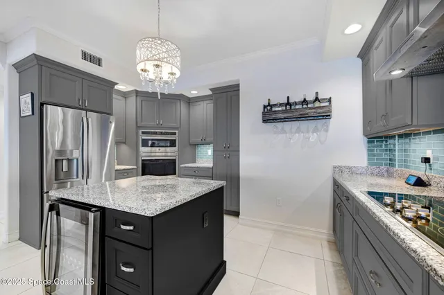 a kitchen with lots of counter space sink and cabinets