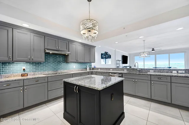 a kitchen with sink cabinets and window