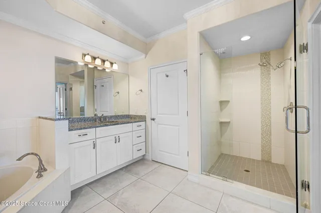 a bathroom with a granite countertop sink mirror and shower