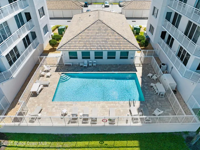 a view of swimming pool with a yard