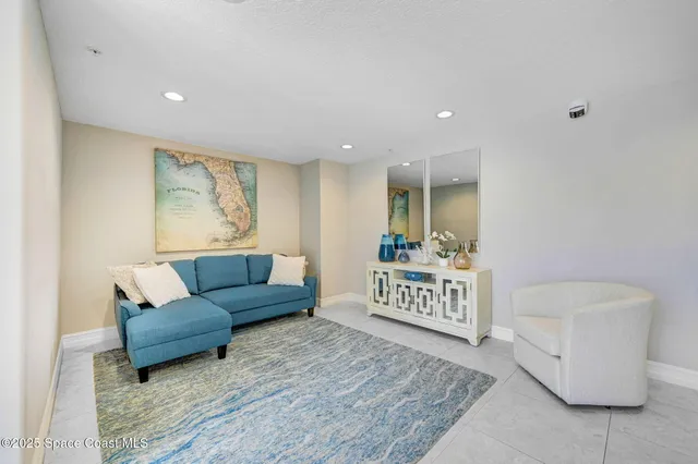 a living room with furniture and a rug