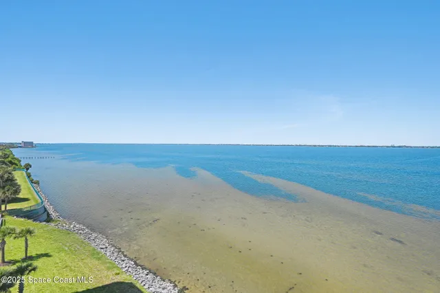 a view of a hallway with wooden floors