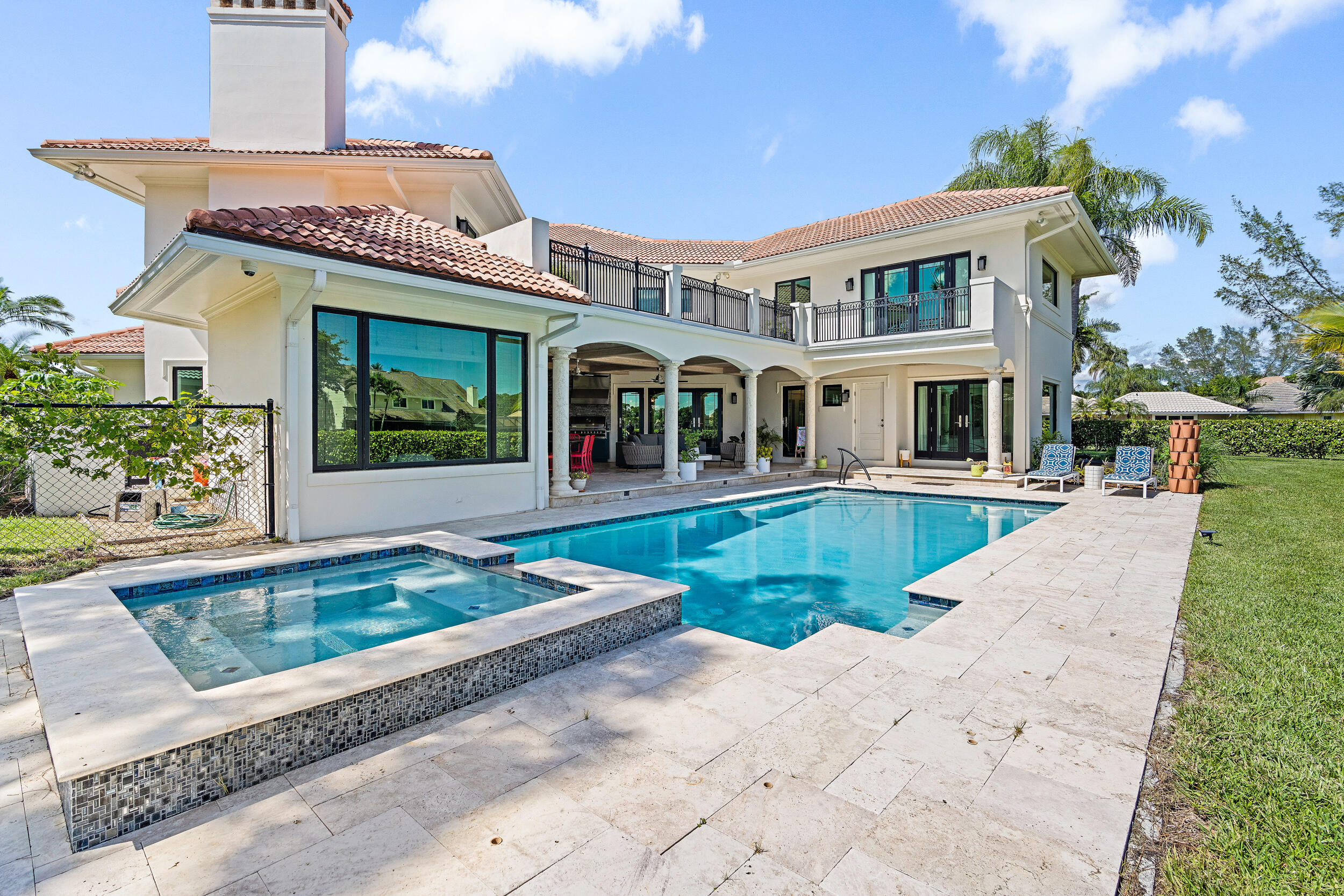 3 Sheldrake Circle Palm Beach Gardens, FL 33418 - Photo 1 of 48 front view of a house with a swimming pool