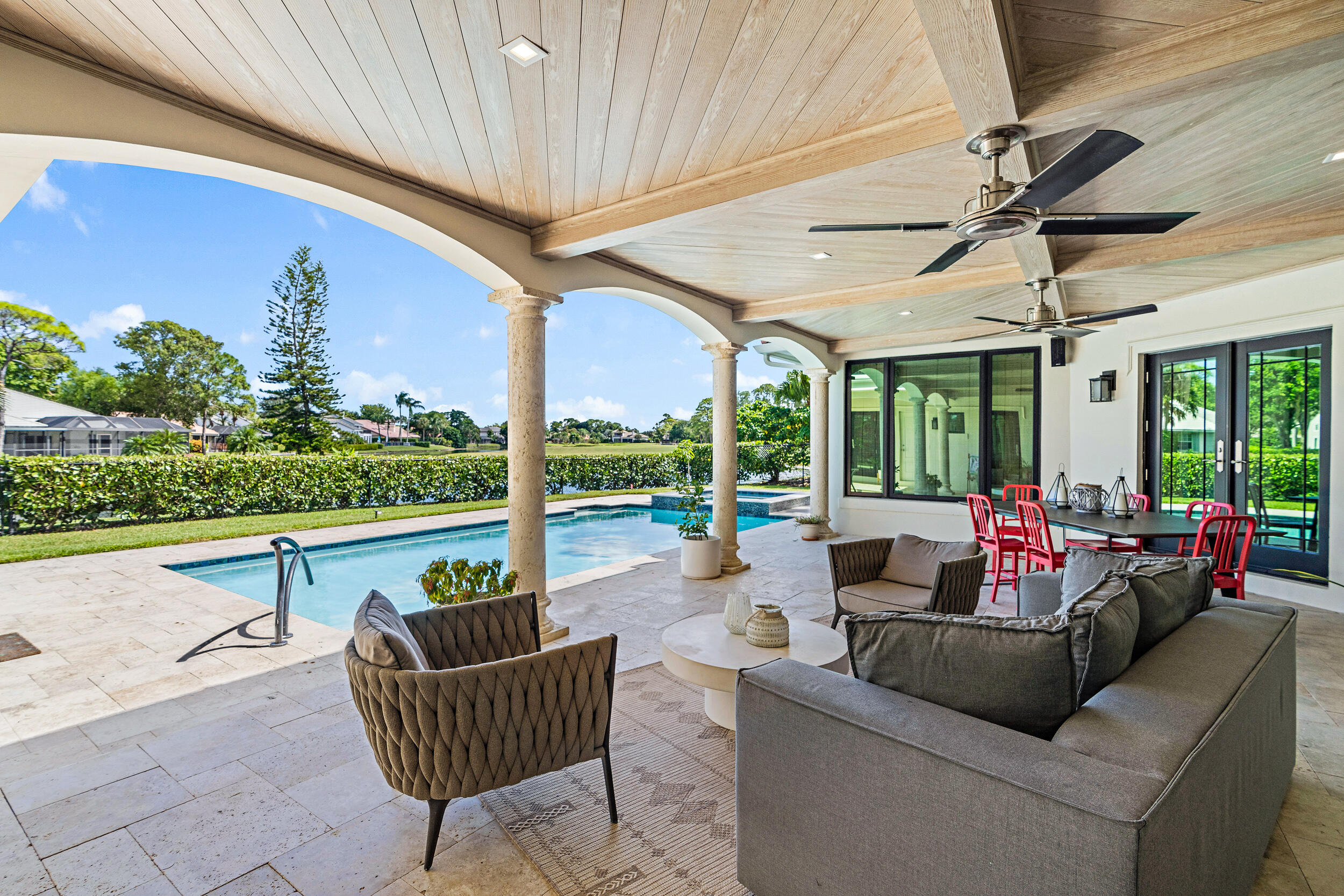 3 Sheldrake Circle Palm Beach Gardens, FL 33418 - Photo 19 of 48 a living room with patio furniture and a garden
