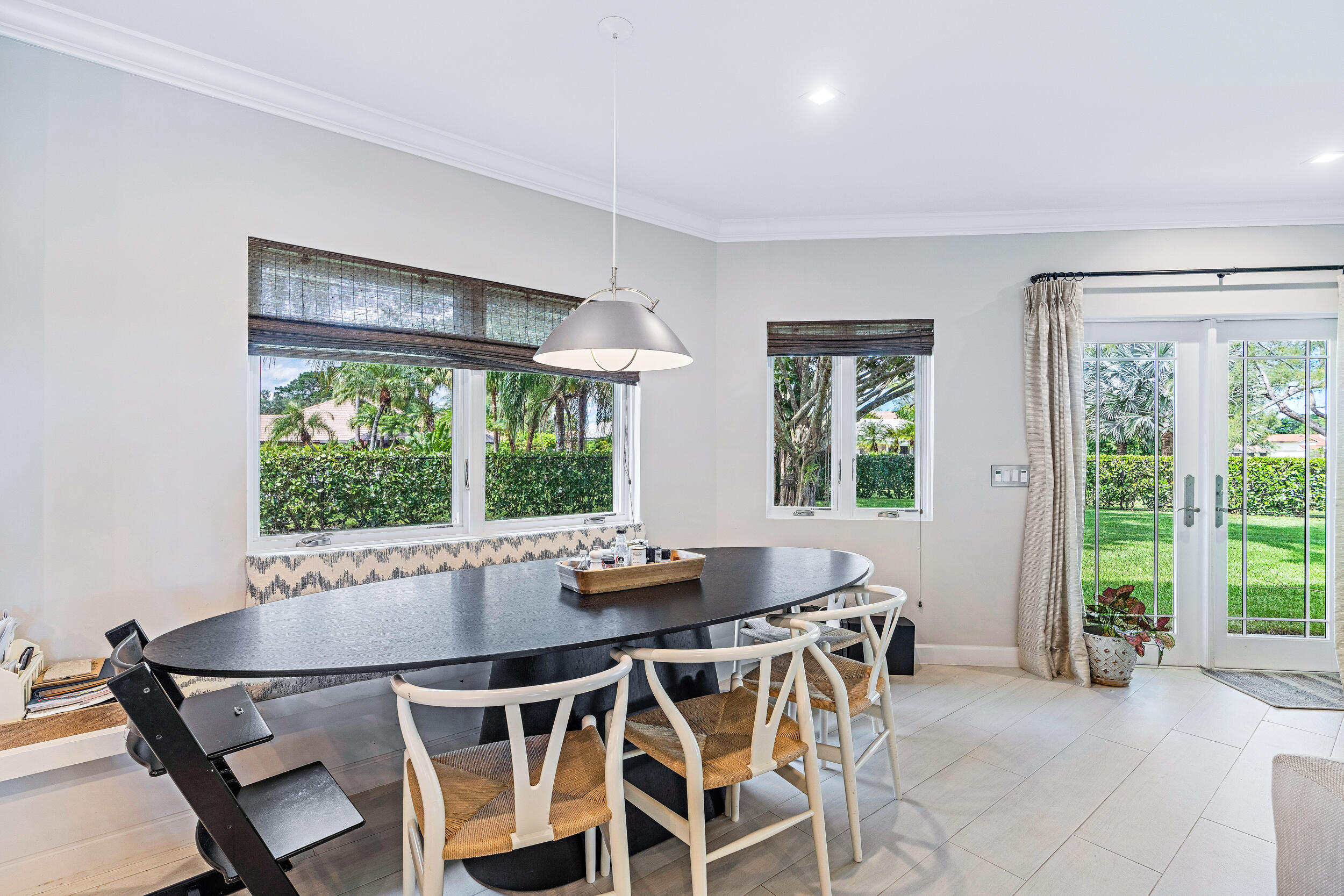 3 Sheldrake Circle Palm Beach Gardens, FL 33418 - Photo 20 of 48 a dining room with furniture a chandelier and wooden floor