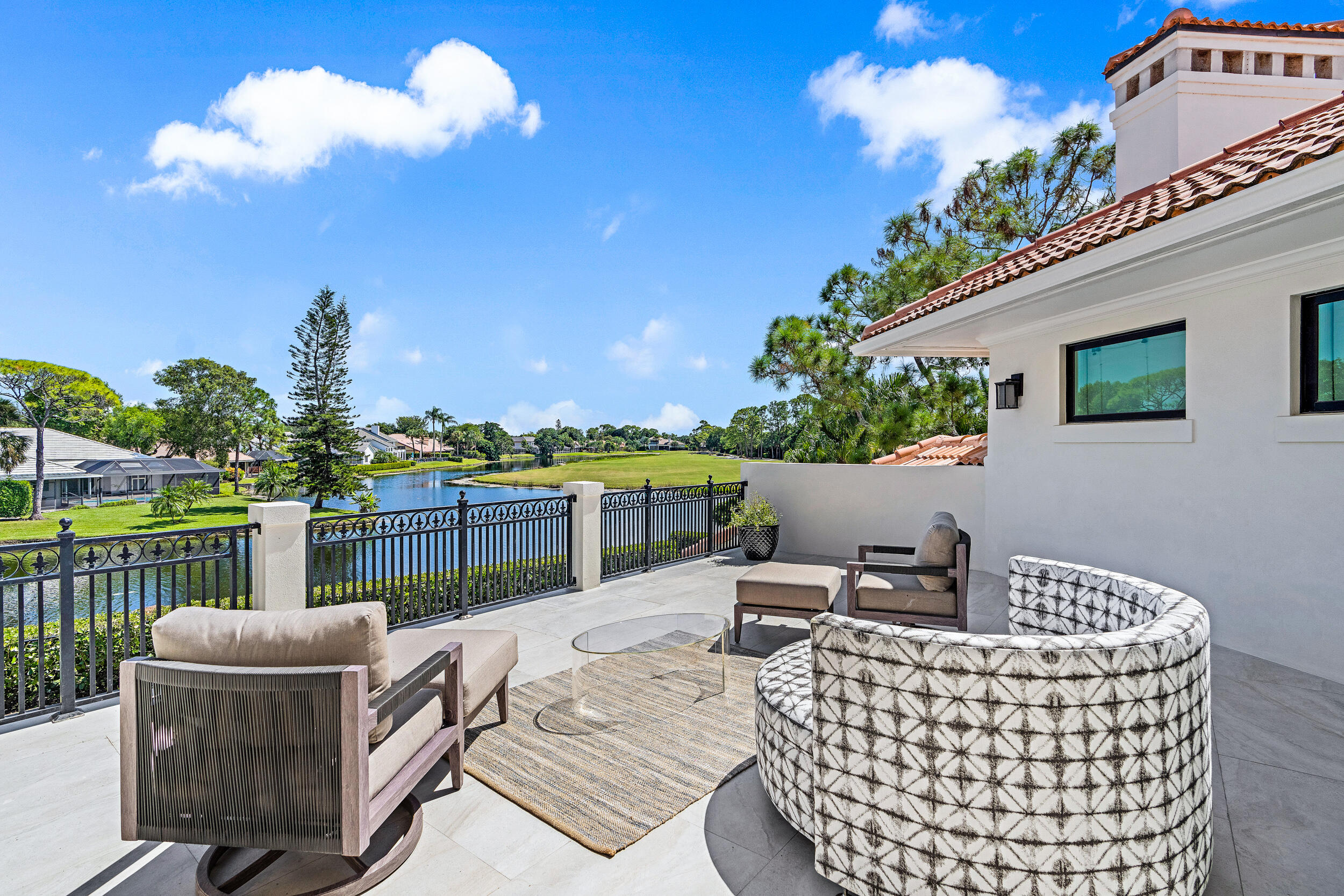 3 Sheldrake Circle Palm Beach Gardens, FL 33418 - Photo 2 of 48 a view of a patio with couches chairs and a table