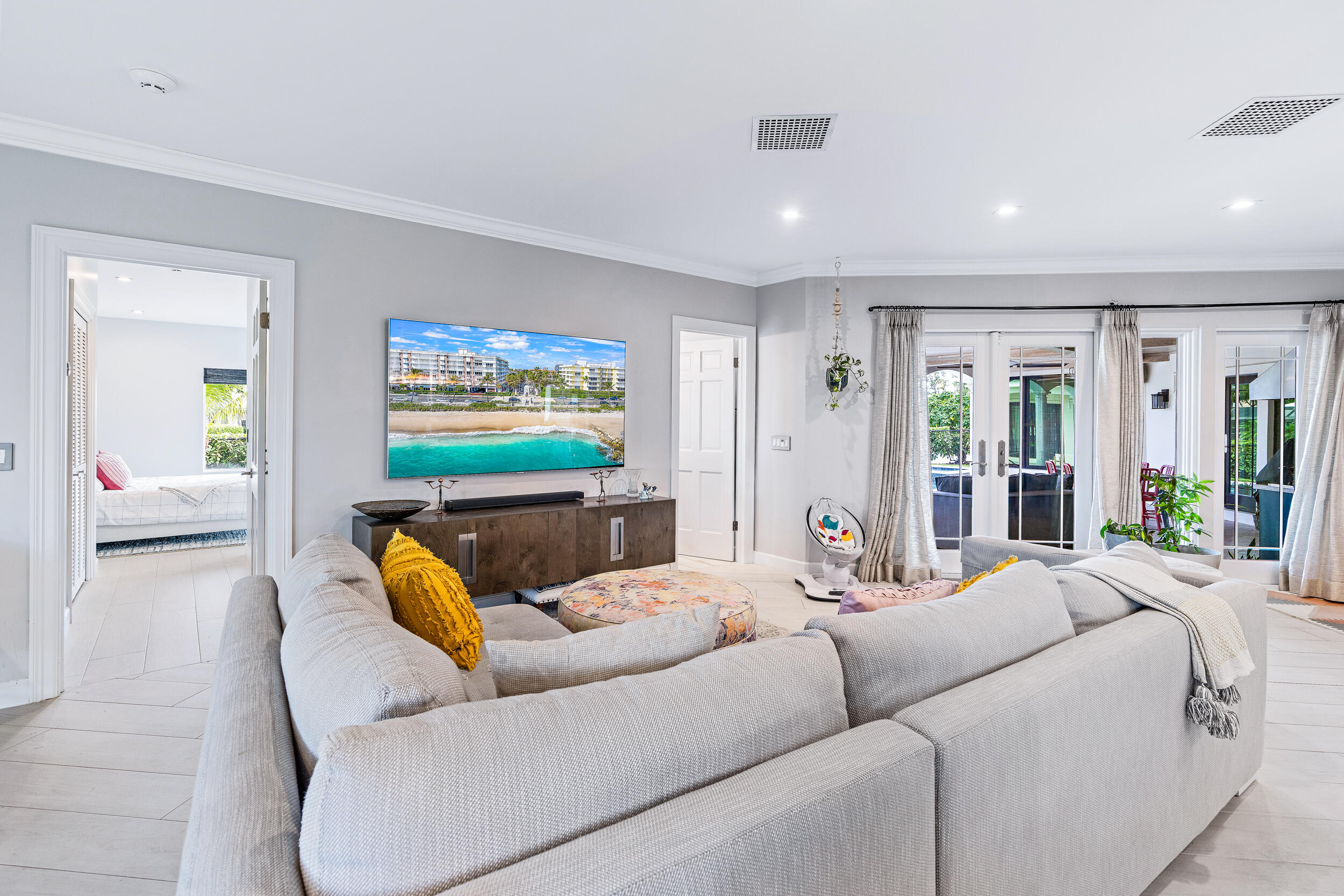 3 Sheldrake Circle Palm Beach Gardens, FL 33418 - Photo 29 of 48 a living room with furniture and a flat screen tv