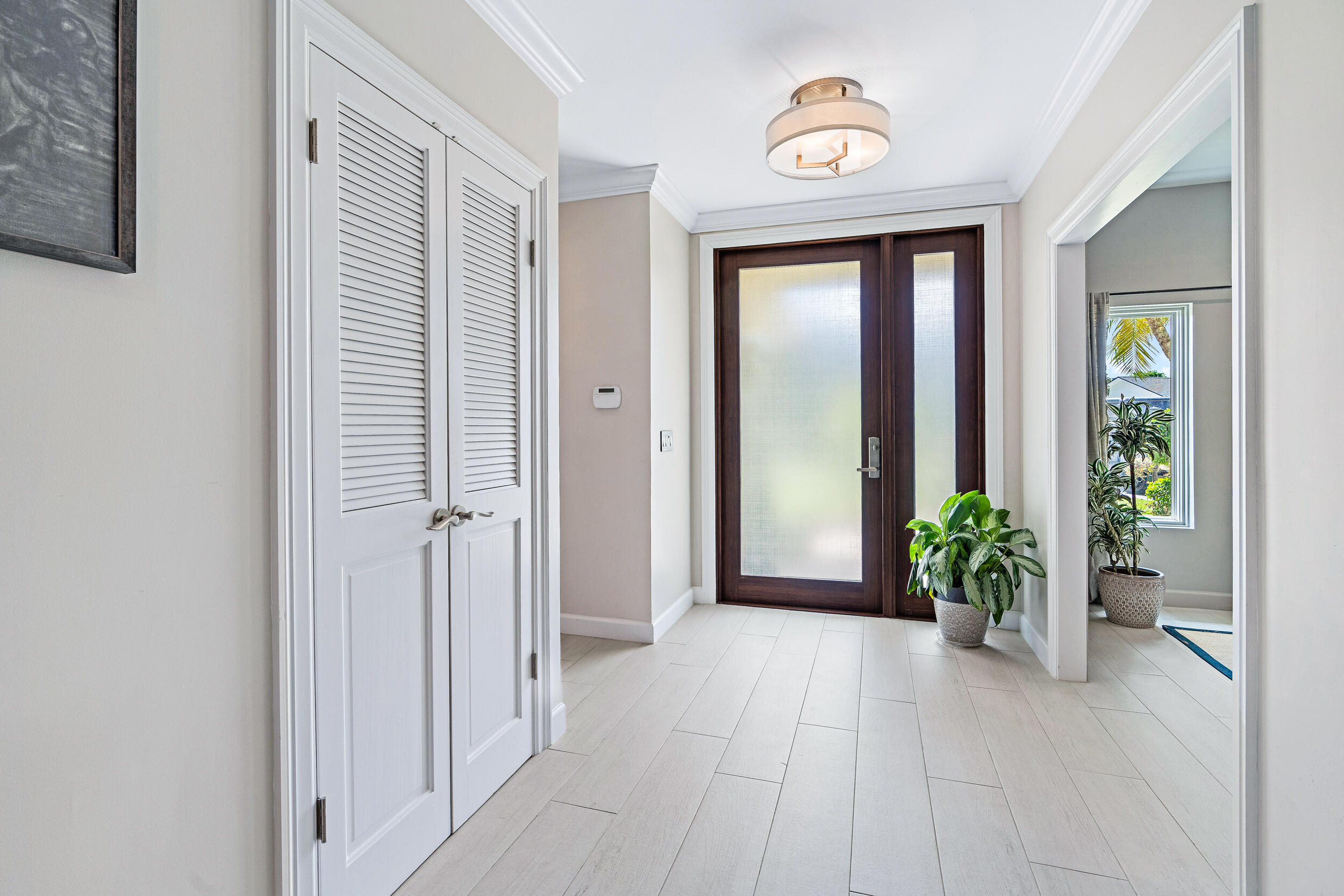 3 Sheldrake Circle Palm Beach Gardens, FL 33418 - Photo 39 of 48 a view of an entryway with wooden floor