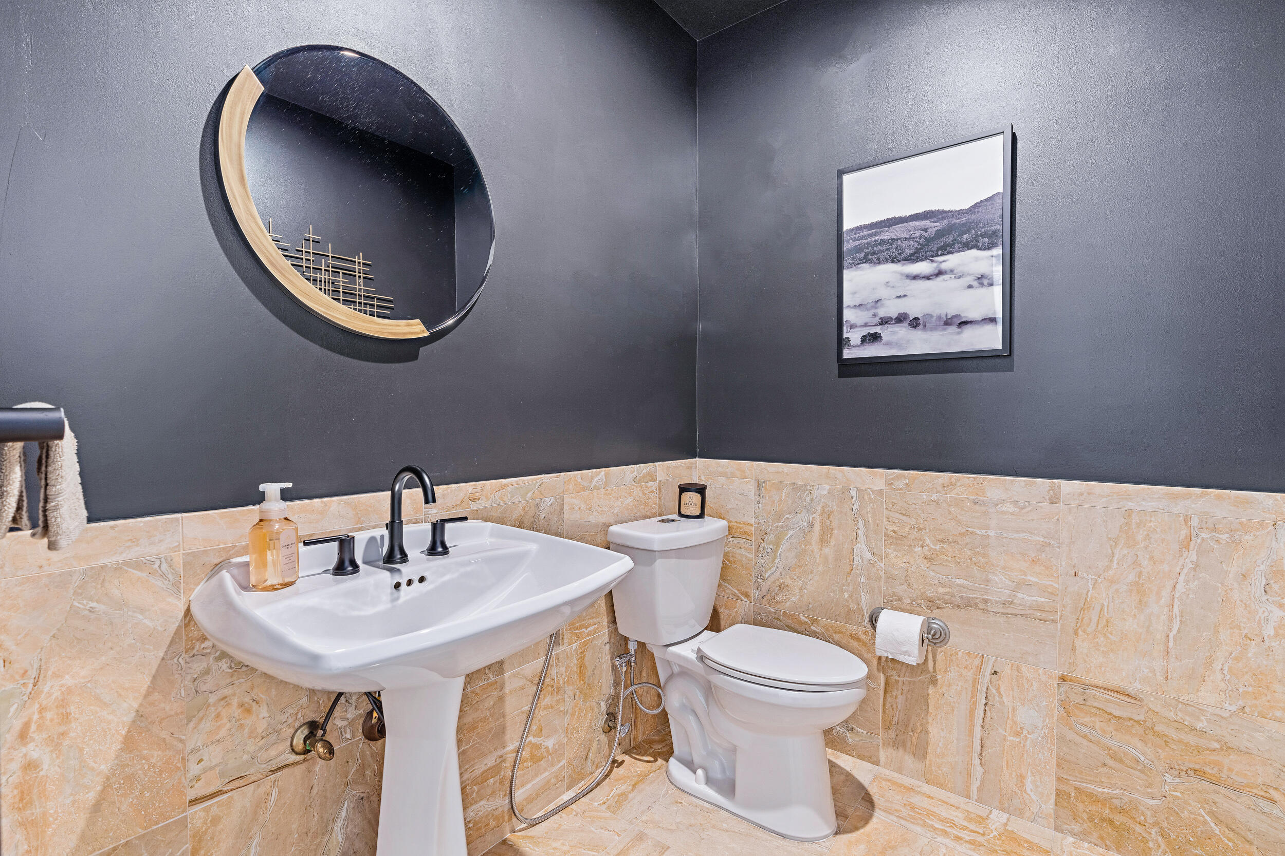 3 Sheldrake Circle Palm Beach Gardens, FL 33418 - Photo 40 of 48 a bathroom with a toilet a sink and mirror