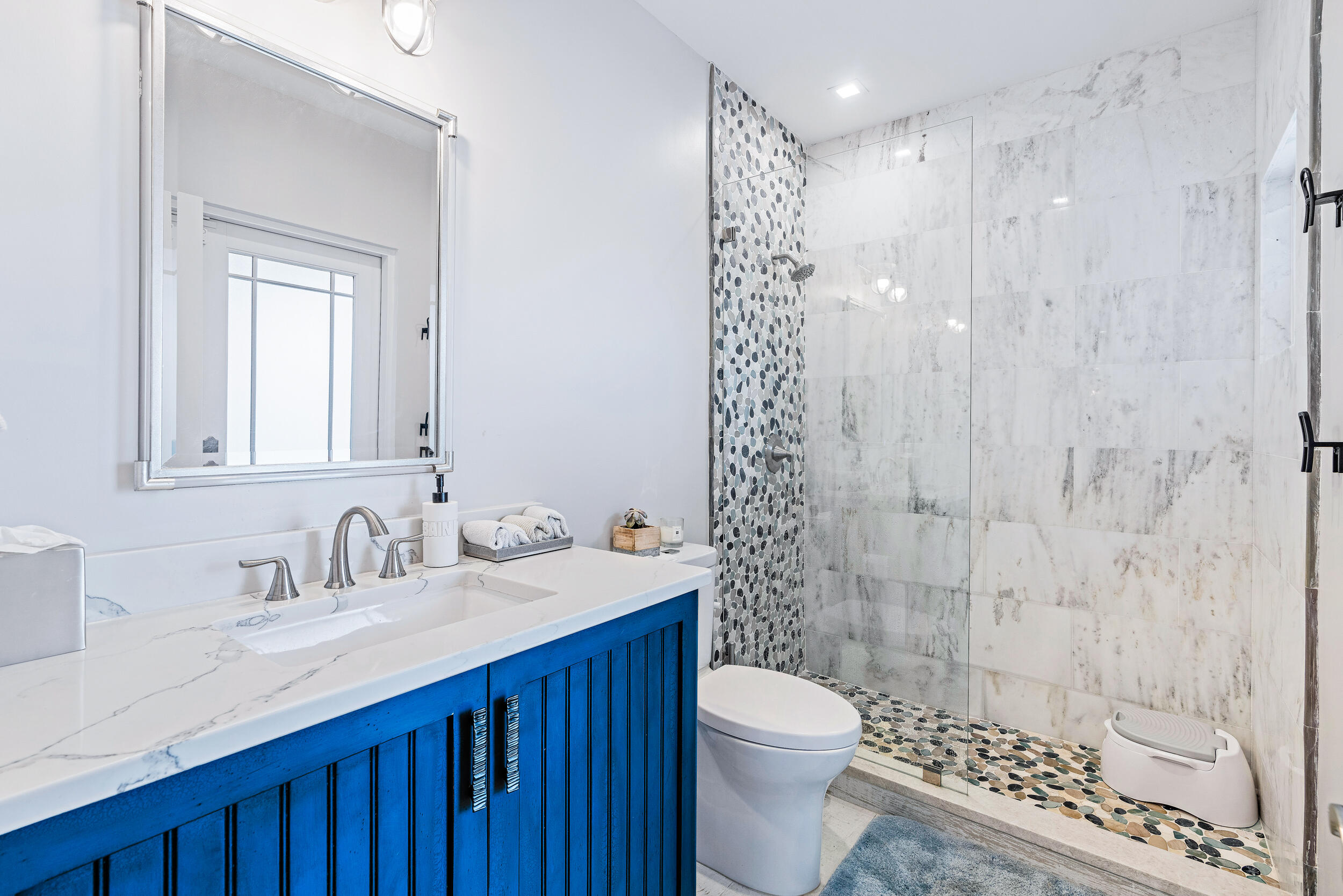 3 Sheldrake Circle Palm Beach Gardens, FL 33418 - Photo 41 of 48 a bathroom with a sink a toilet and shower