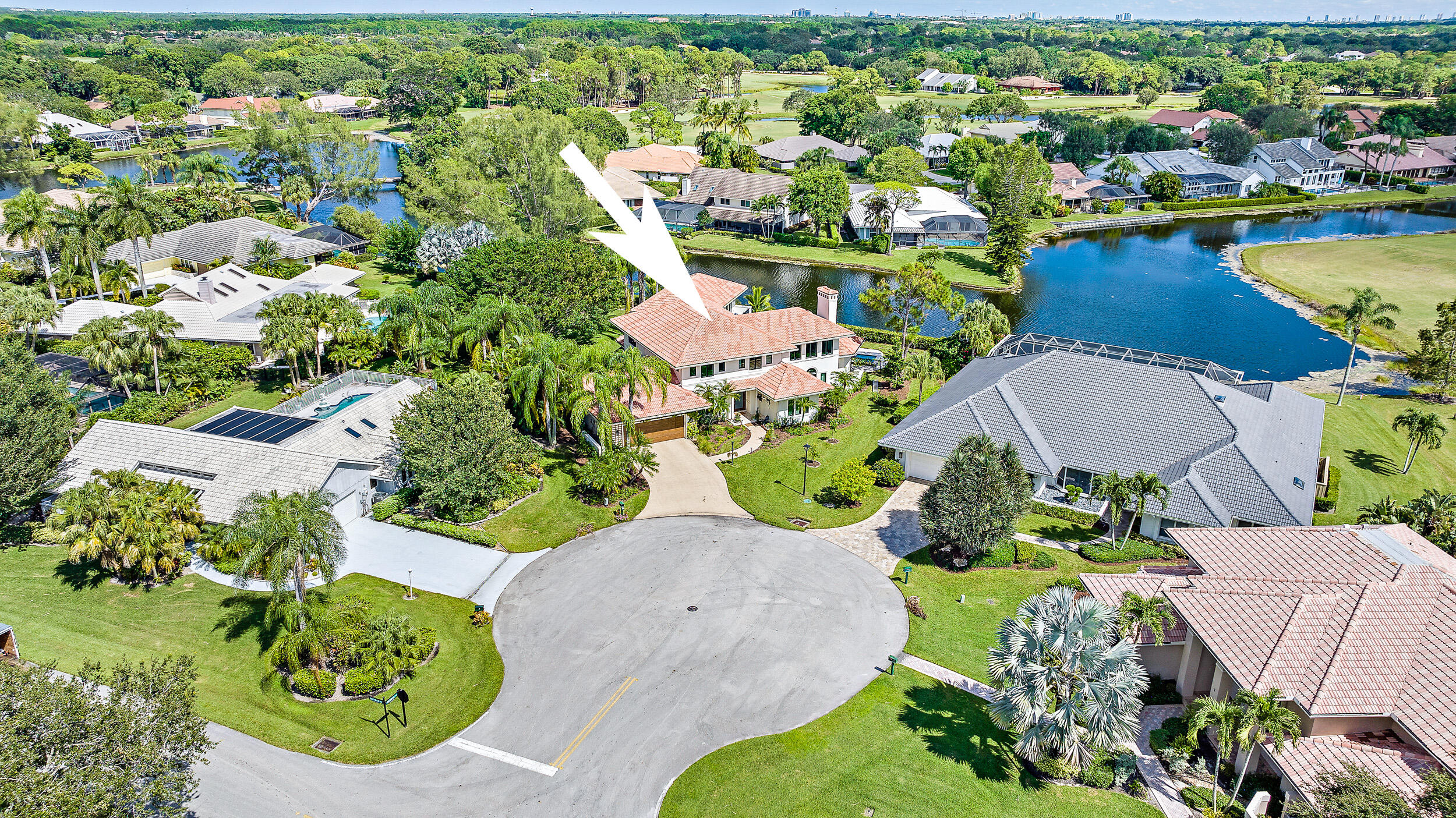 3 Sheldrake Circle Palm Beach Gardens, FL 33418 - Photo 44 of 48 an aerial view of a house with a garden and lake view