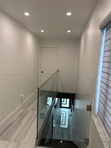 a view of hallway with walk in closet