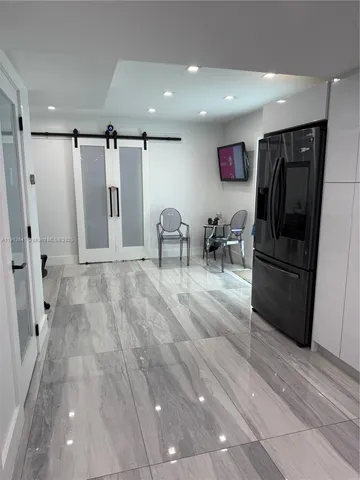 a kitchen with a sink a stove and refrigerator