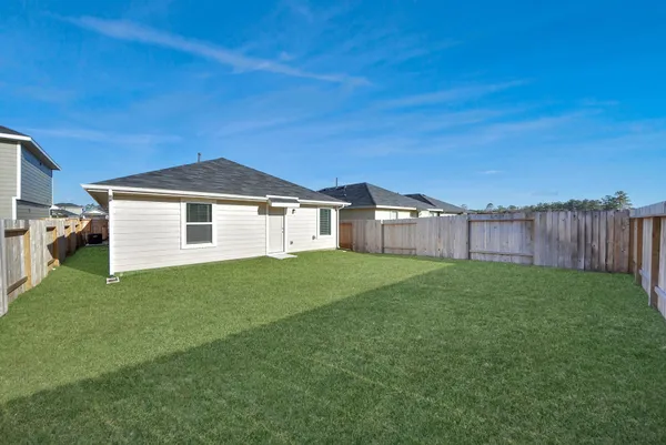 a view of a backyard with green space