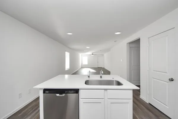 a kitchen with a sink and cabinets