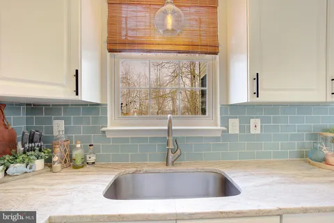 a kitchen with a sink and a window