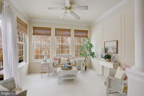 a living room with furniture and windows