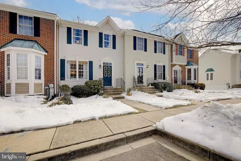 a view of a white house with a outdoor space
