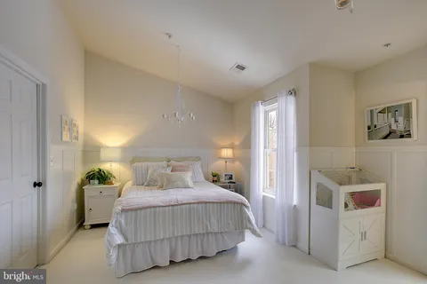 a bedroom with a bed and a cabinets