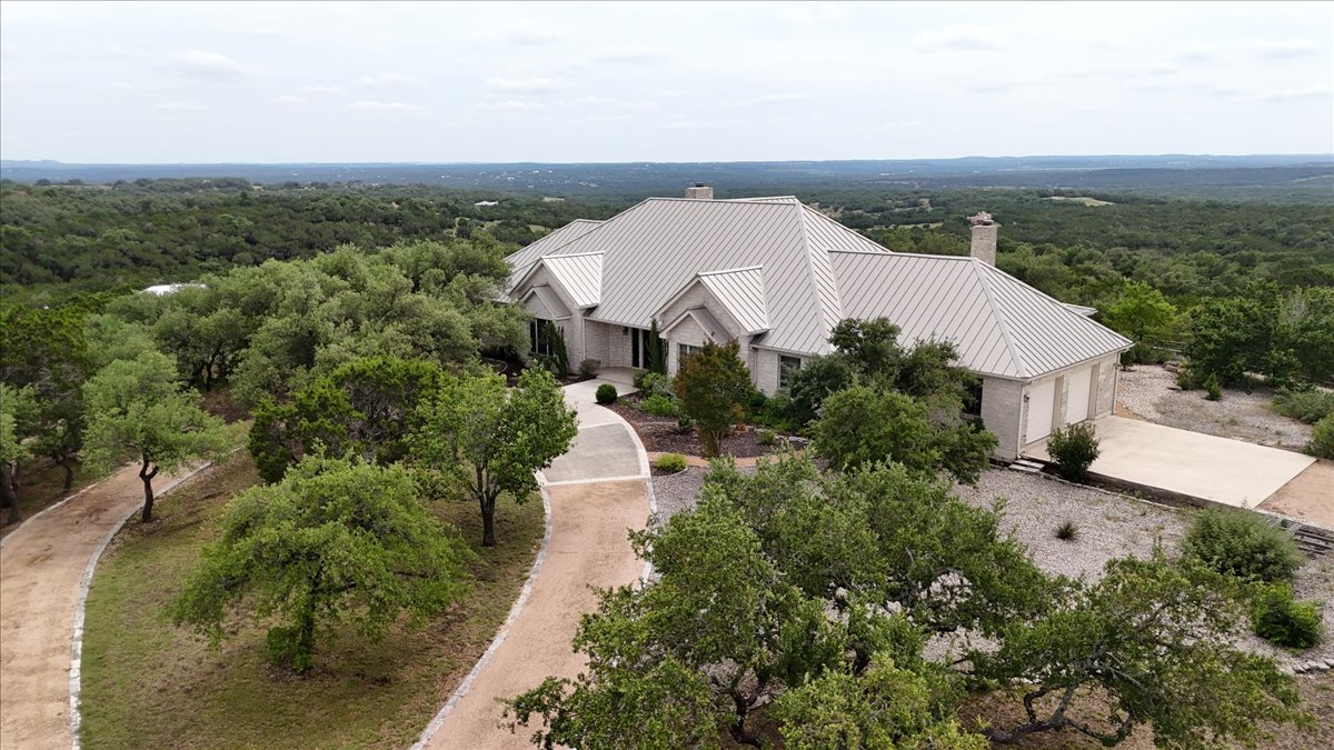 167 Wimberley Ranch Drive Wimberley, TX 78676 - Photo 1 of 40 a view of a houses with a yard and lake view