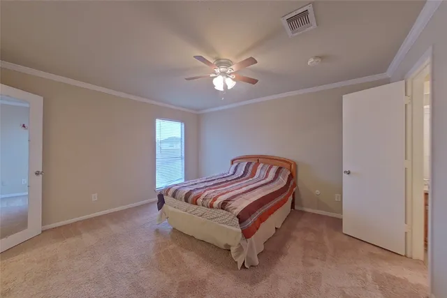 a bed room with a bed and a chandelier