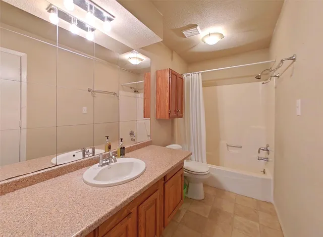 a bathroom with a sink double vanity and a toilet